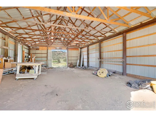 a living room with furniture and a lamp