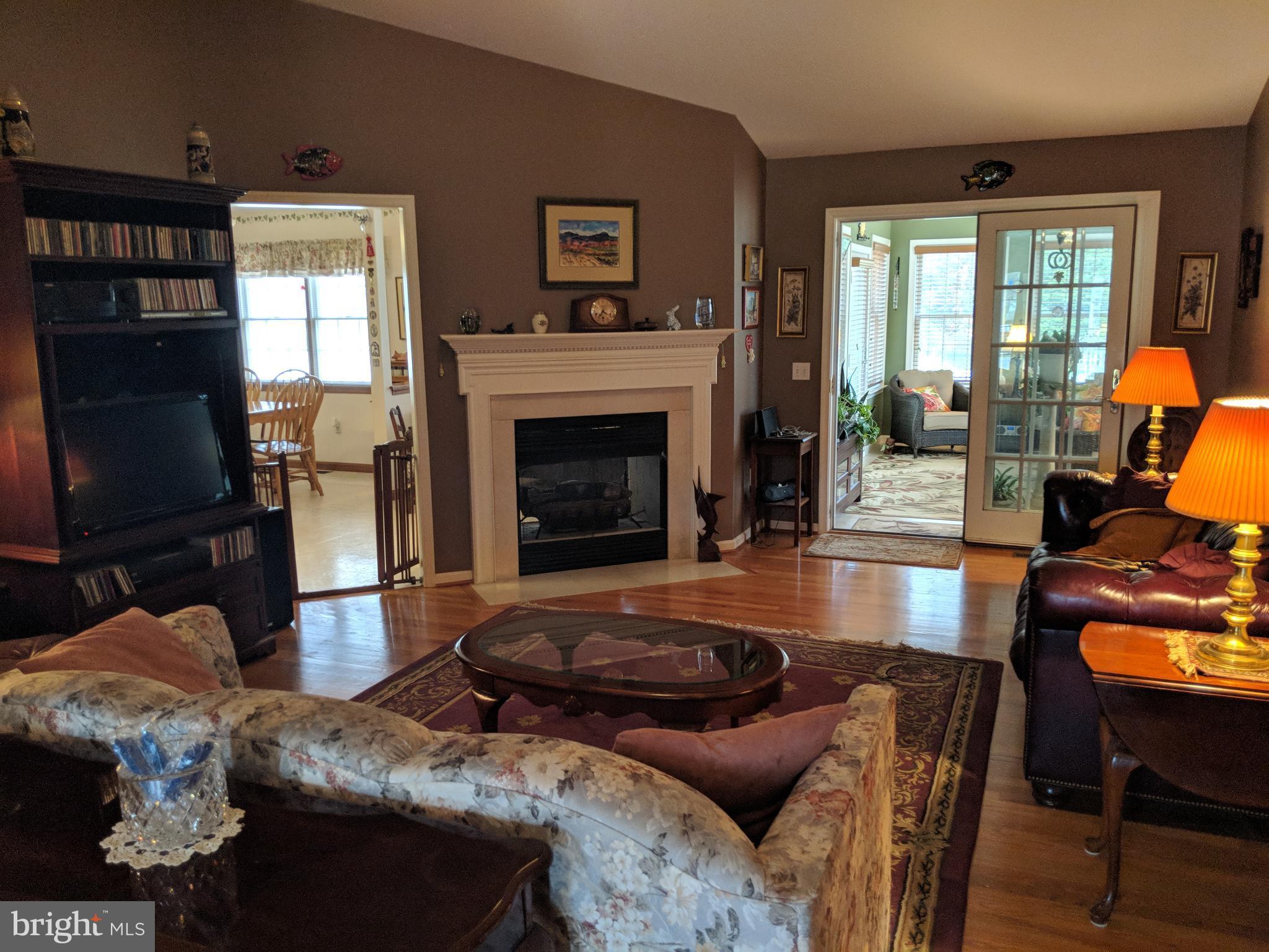 206 Ackerman Road Stevensville, MD 21666 - Photo 3 of 27 Living Room with vaulted ceiling and fireplace