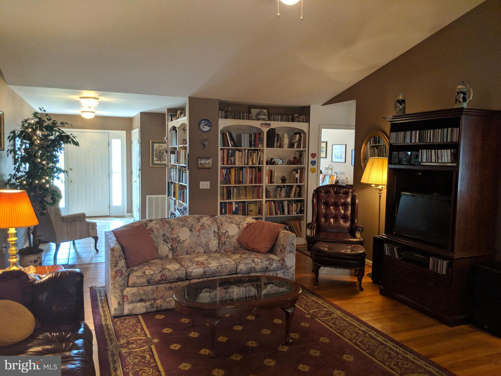 206 Ackerman Road Stevensville, MD 21666 - Photo 4 of 27 Living Room with vaulted ceiling and fireplace