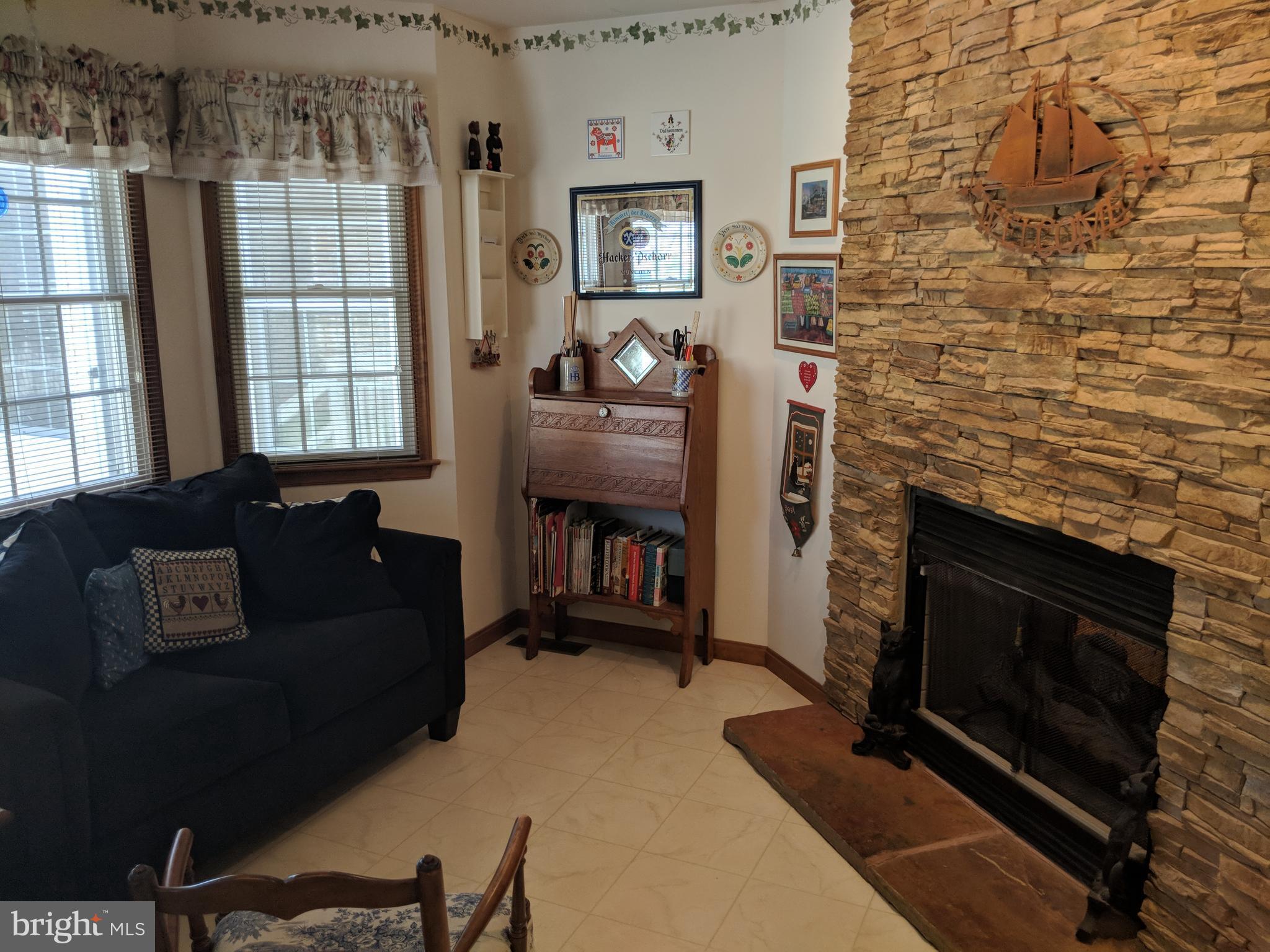 206 Ackerman Road Stevensville, MD 21666 - Photo 8 of 27 Kitchen seating area by fireplace