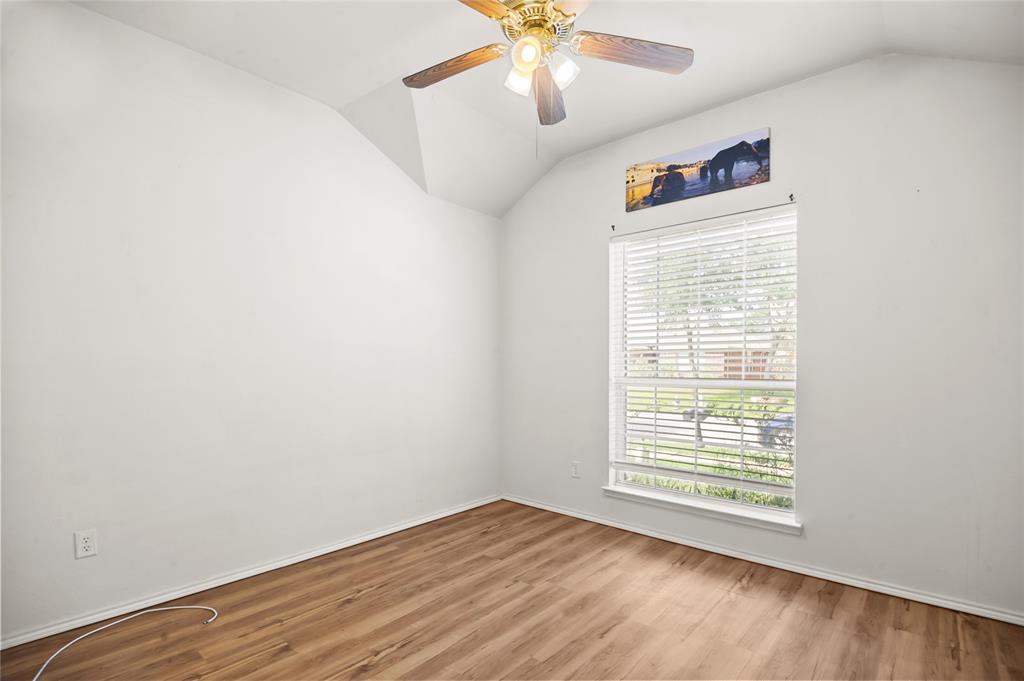 3041 Winding Meadow Trail Princeton, TX 75407 - Photo 16 of 20 an empty room with a window and a fan