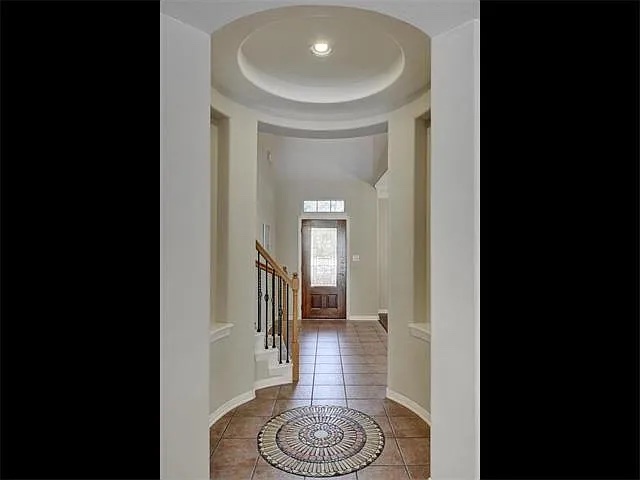 1832 Nelson Ranch Loop Cedar Park, TX 78613 - Photo 5 of 15 A grand entrance with a vaulted ceiling and elegant tile flooring invites you inside.