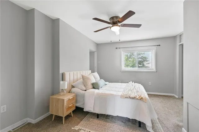 a bed room with a bed and a window