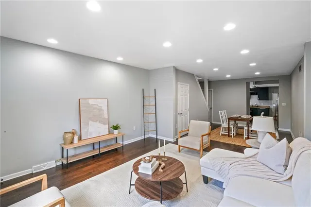 a living room with furniture and a table