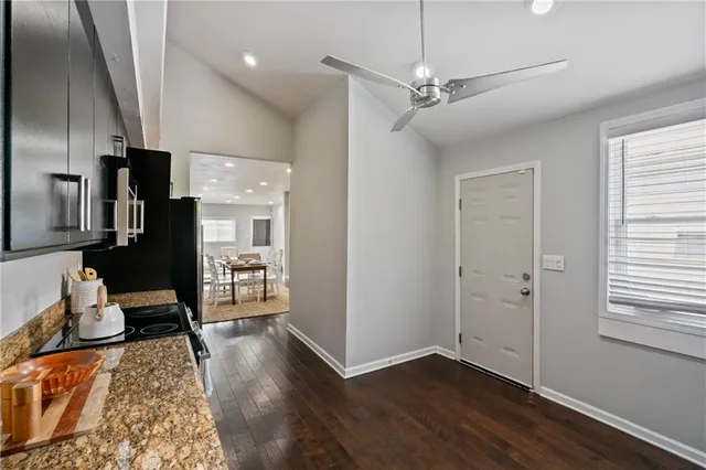 a view of a livingroom with hardwood floor and a ceiling fan