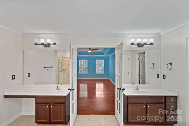 a bathroom with a sink vanity and a mirror