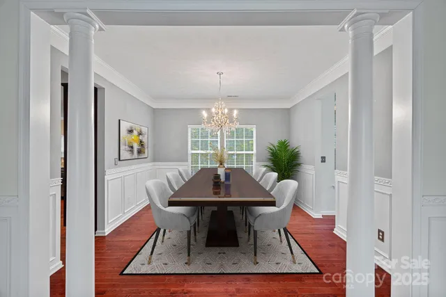 a view of a dining room with furniture window and wooden floor