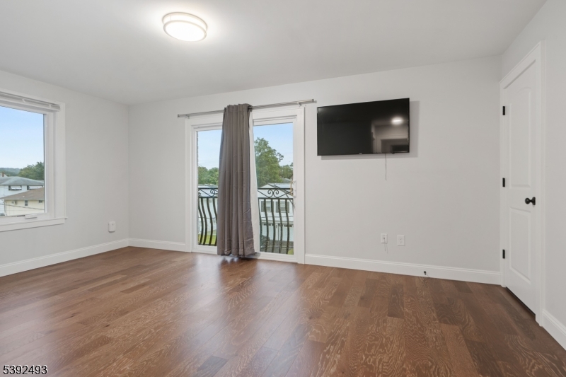 22 Arcadia Place Union, NJ 07088 - Photo 13 of 33 an empty room with wooden floor and windows