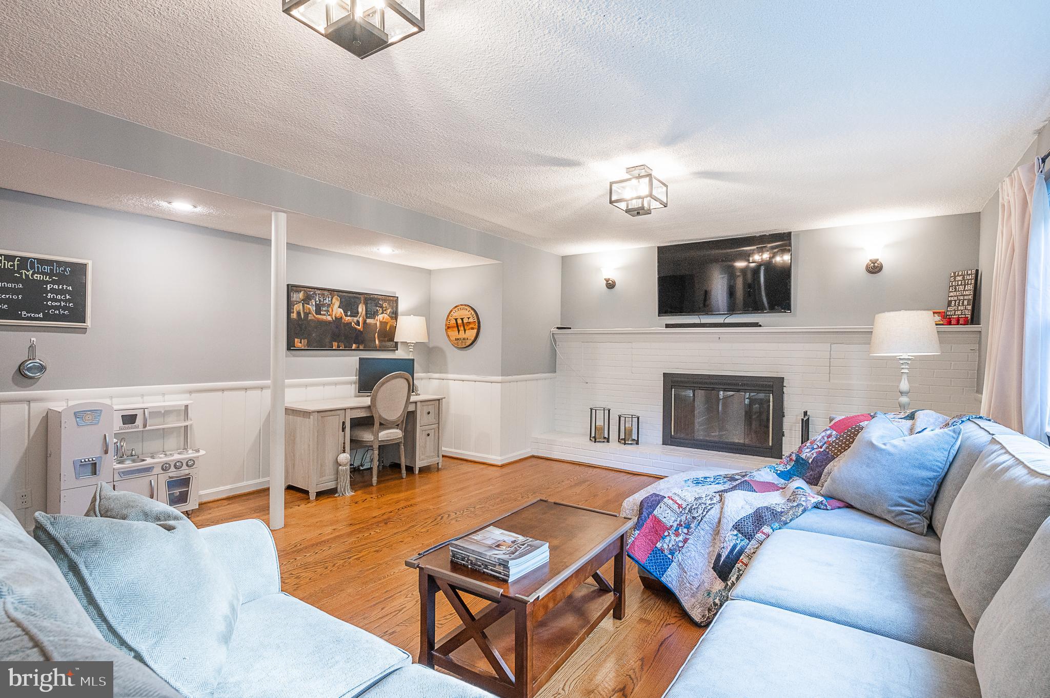 3675 Military Road Arlington, VA 22207 - Photo 24 of 40 Brick Fireplace + Recessed & Sconce Lighting