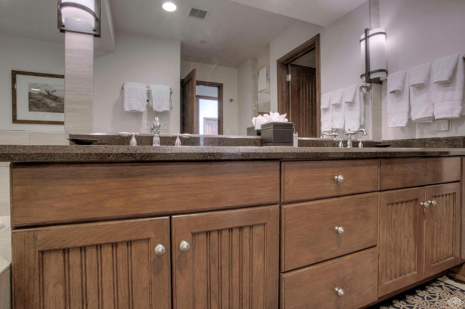 141 Scott Hill Road, Unit 402 Beaver Creek, CO 81620 - Photo 18 of 23 a kitchen with a sink and a mirror
