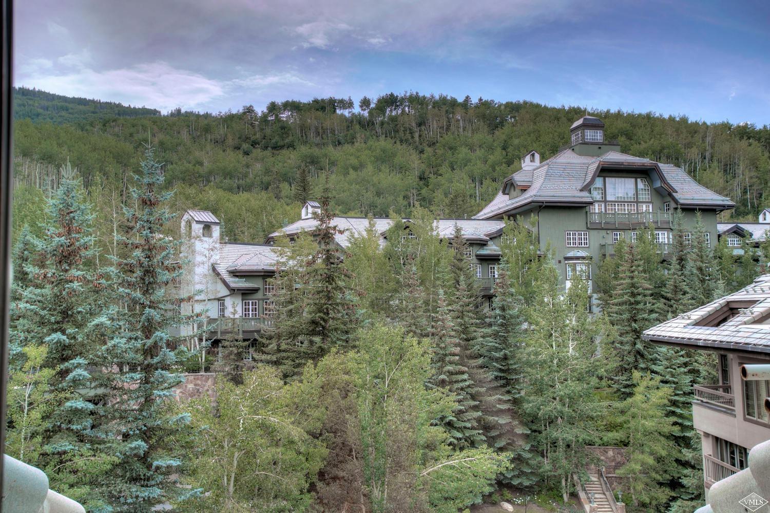 141 Scott Hill Road, Unit 402 Beaver Creek, CO 81620 - Photo 20 of 23 a view of a lake with a mountain in the background