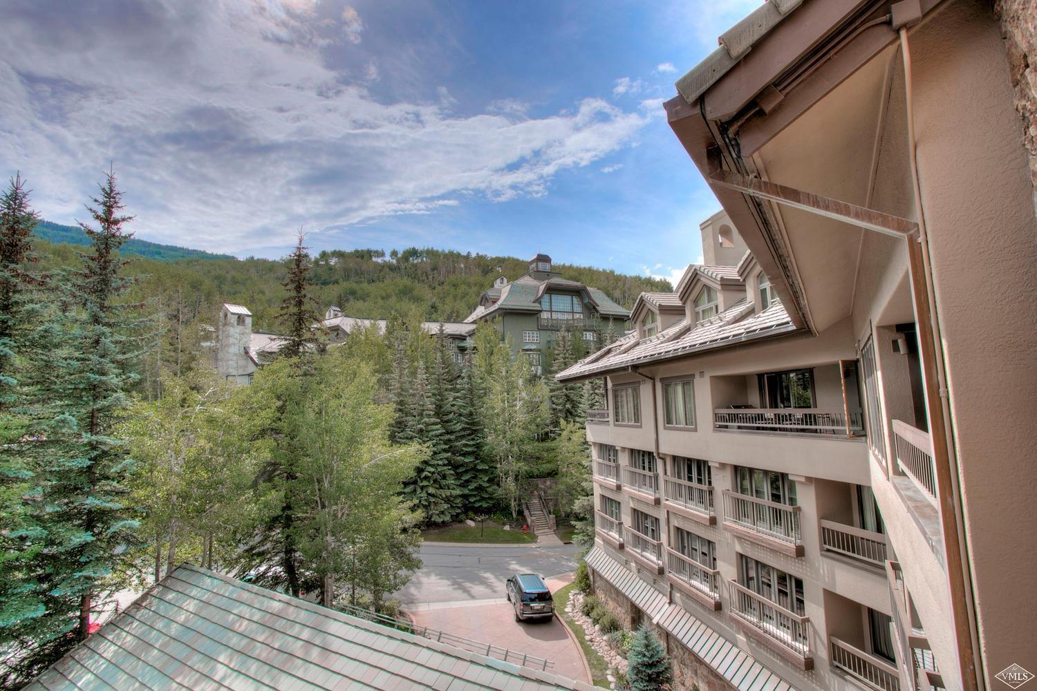 141 Scott Hill Road, Unit 402 Beaver Creek, CO 81620 - Photo 21 of 23 a view of a house with a yard