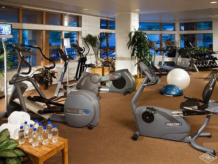 141 Scott Hill Road, Unit 402 Beaver Creek, CO 81620 - Photo 22 of 23 a room with gym equipment and wooden floor