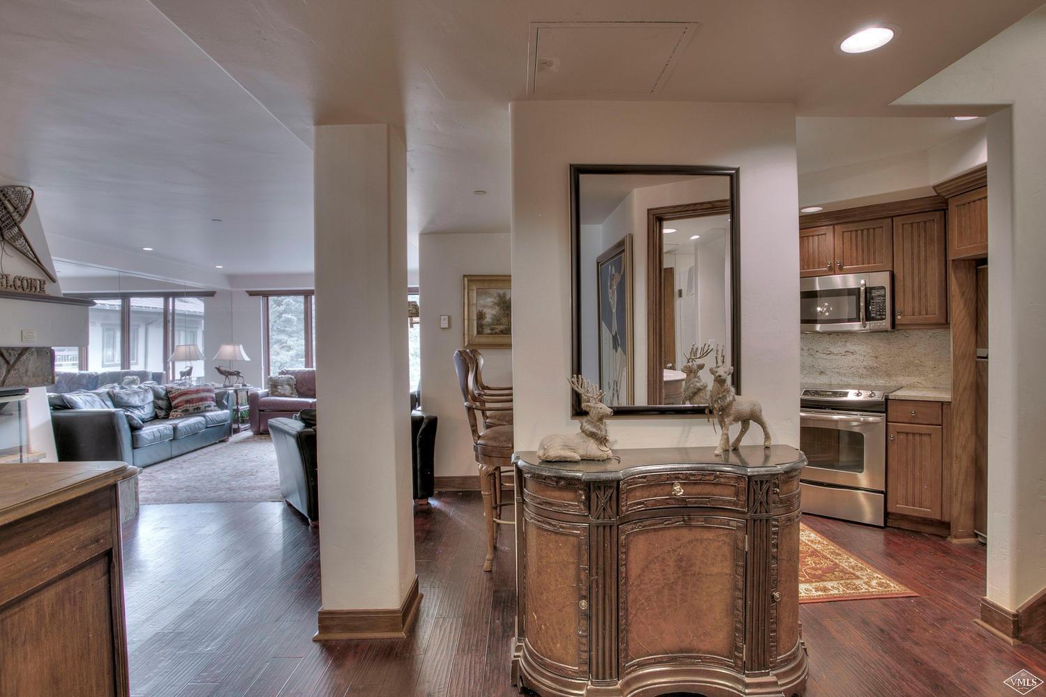 141 Scott Hill Road, Unit 402 Beaver Creek, CO 81620 - Photo 9 of 23 a view of a kitchen counter top space with stainless steel appliances