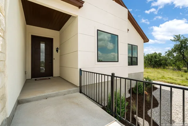 a view of a house with wooden floor and a yard
