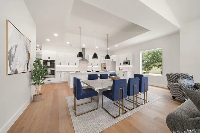 a view of a dining room with furniture window and wooden floor