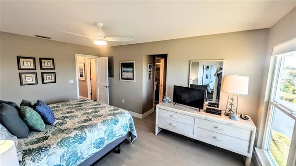 a view of an entryway with wooden floor and stairs