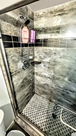 a bedroom with bed and a window