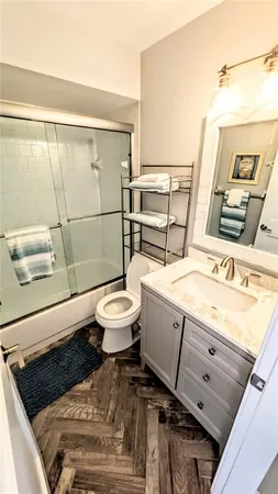 a view of a glass door with a lake from a window