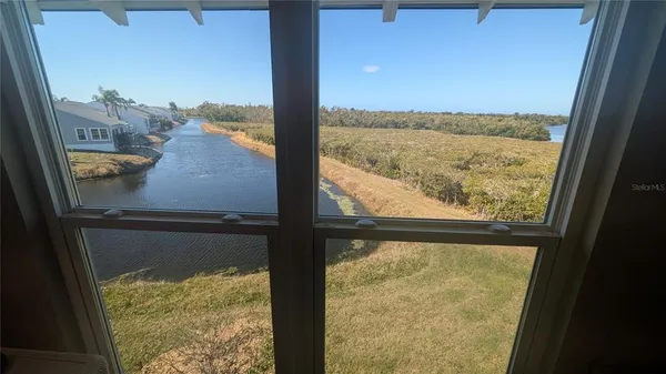 a view of swimming pool with seating space