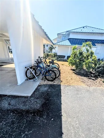 a swimming pool with outdoor seating and wooden floor