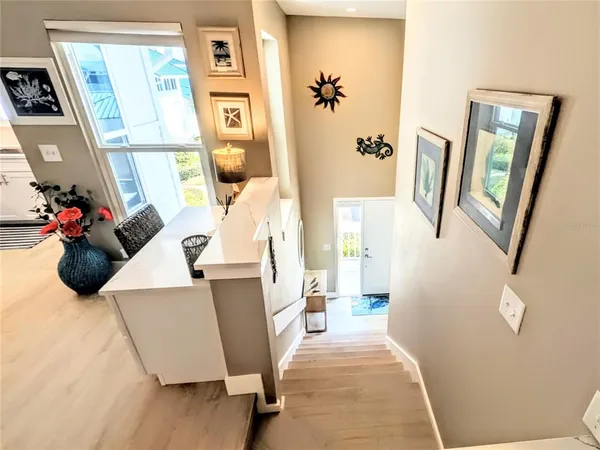 a bedroom with furniture and a large window