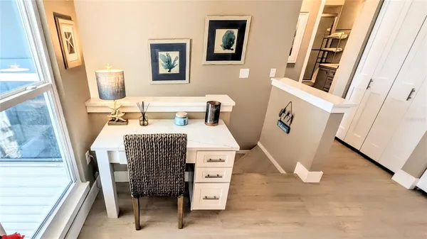 a kitchen with a sink appliances and cabinets