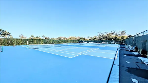 a view of roof deck with wooden floor and outdoor seating