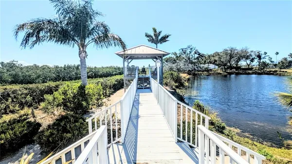 a view of a dining room with furniture and a book shelf