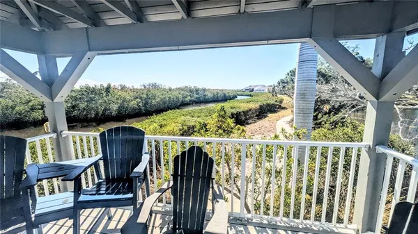 a view of a dining room kitchen with furniture and wooden floor