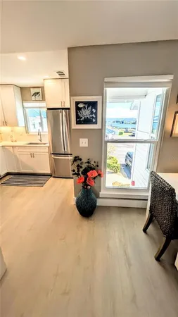 a kitchen with a sink stove top oven and cabinets