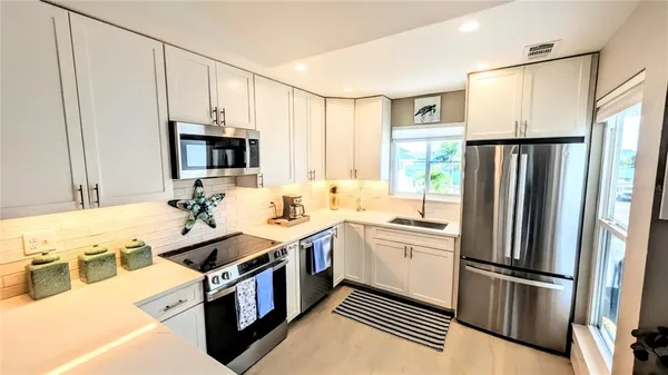 a dining table with chairs and wooden floor