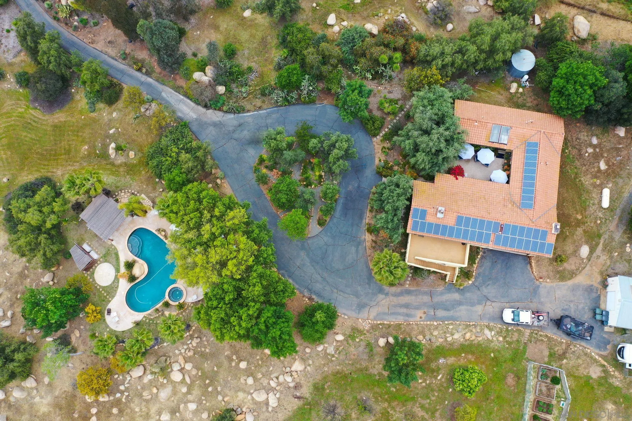 16010 Lyons Valley Road Jamul, CA 91935 - Photo 2 of 2 an aerial view of a house with swimming pool and garden