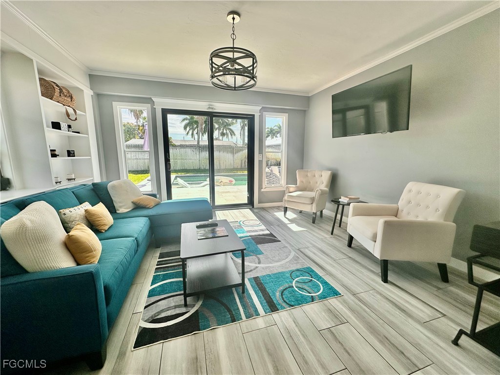 754 105th Avenue North Naples, FL 34108 - Photo 13 of 32 a living room with furniture and a large window