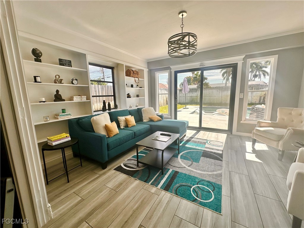 754 105th Avenue North Naples, FL 34108 - Photo 14 of 32 a living room with furniture and a large window