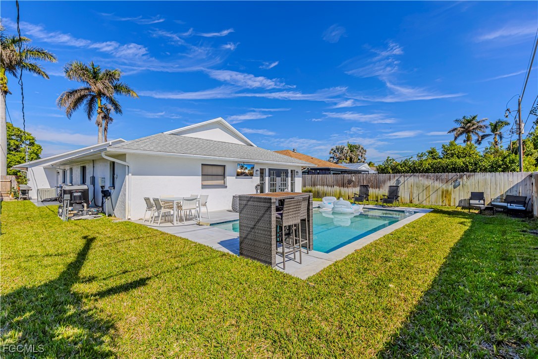 754 105th Avenue North Naples, FL 34108 - Photo 22 of 32 a view of a house with swimming pool