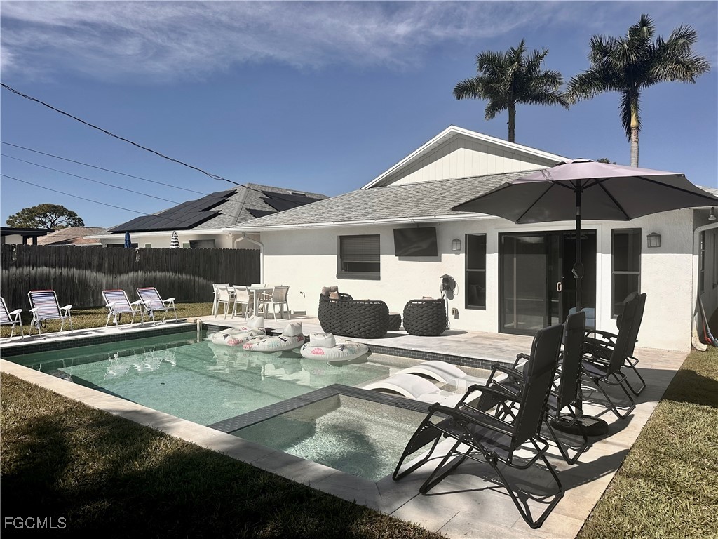 754 105th Avenue North Naples, FL 34108 - Photo 29 of 32 a view of a house with backyard outdoor seating area and furniture