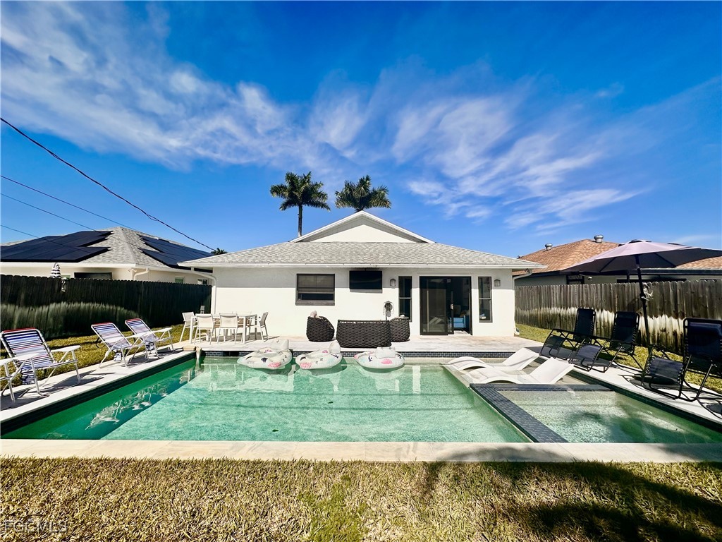 754 105th Avenue North Naples, FL 34108 - Photo 31 of 32 a front view of a house with garden and sitting area