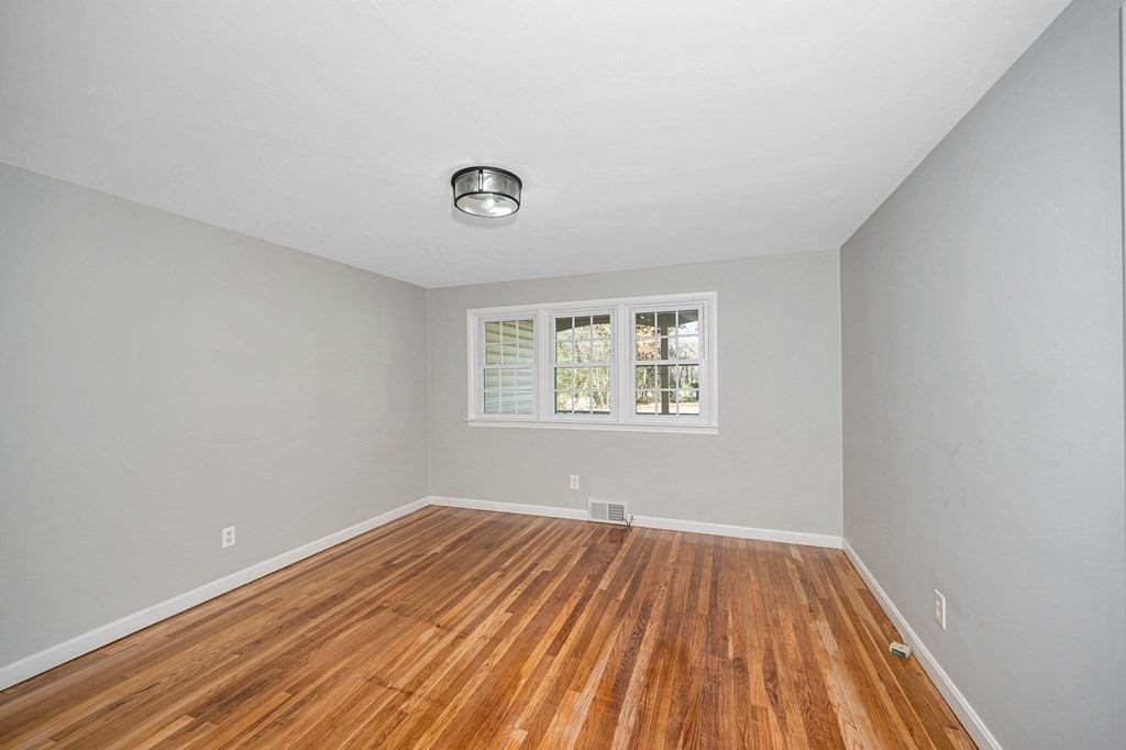 26 Ledge Road Chelmsford, MA 01863 - Photo 5 of 33 an empty room with a window
