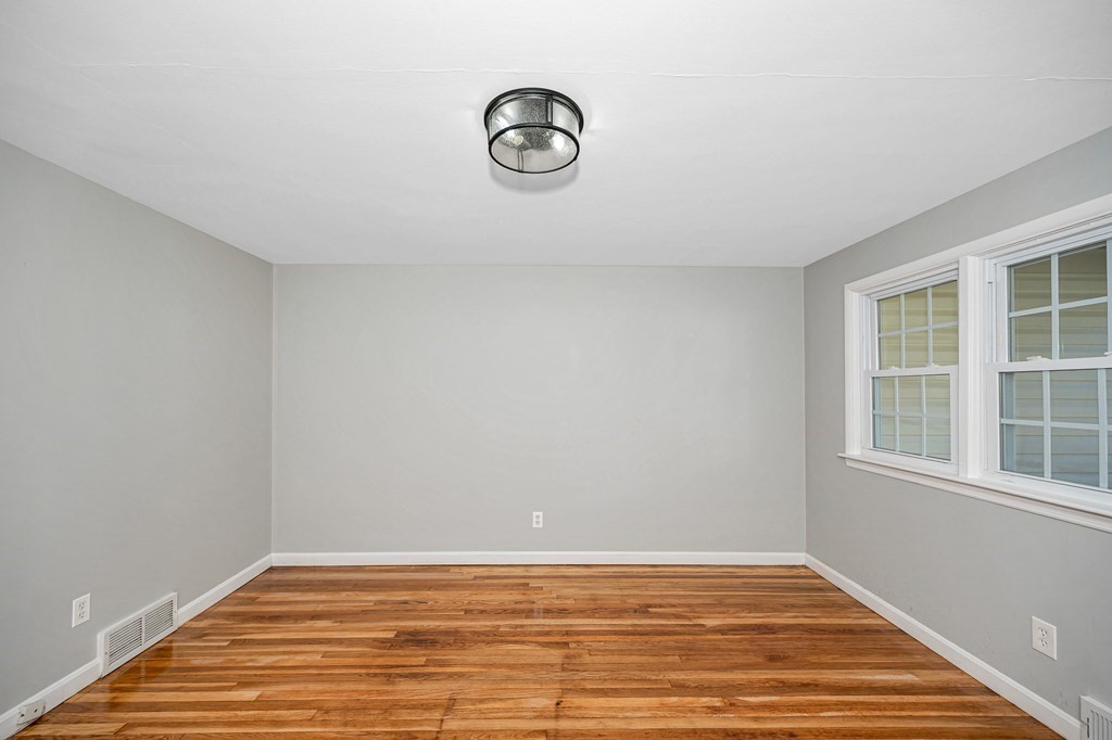 26 Ledge Road Chelmsford, MA 01863 - Photo 6 of 33 a view of a room with wooden floor and windows