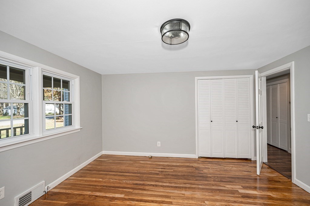 26 Ledge Road Chelmsford, MA 01863 - Photo 7 of 33 a view of a livingroom with wooden floor and a window