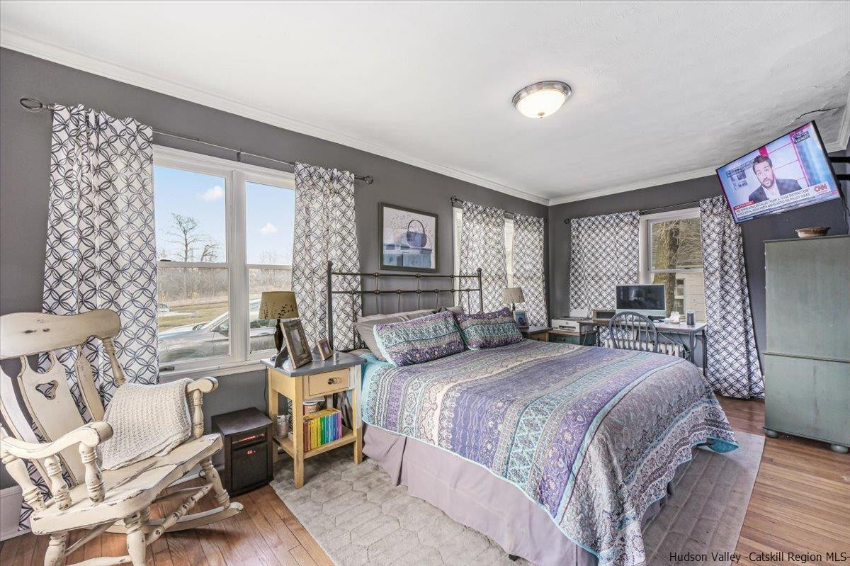 98 North Road Highland, NY 12528 - Photo 11 of 33 a bedroom with a bed and wooden floor