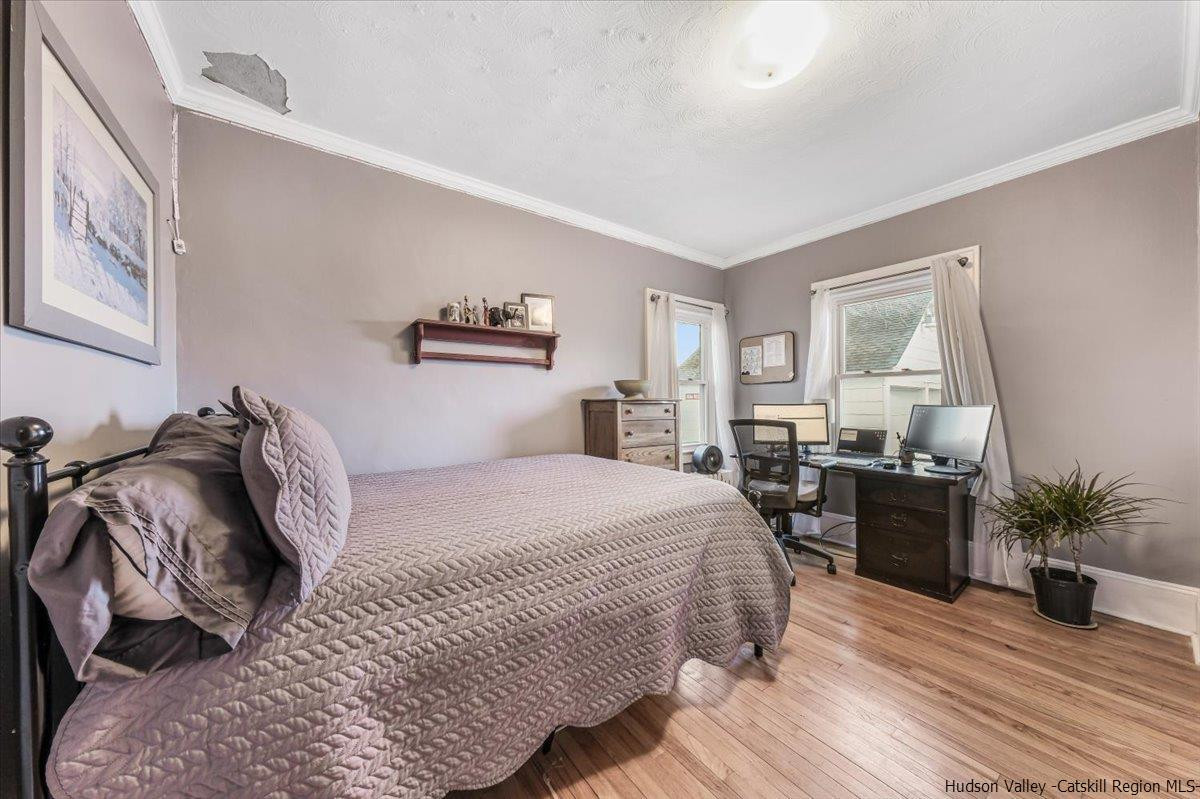 98 North Road Highland, NY 12528 - Photo 16 of 33 a bedroom with a bed and wooden floor