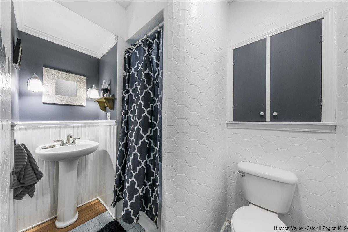 98 North Road Highland, NY 12528 - Photo 17 of 33 a bathroom with a toilet sink and mirror