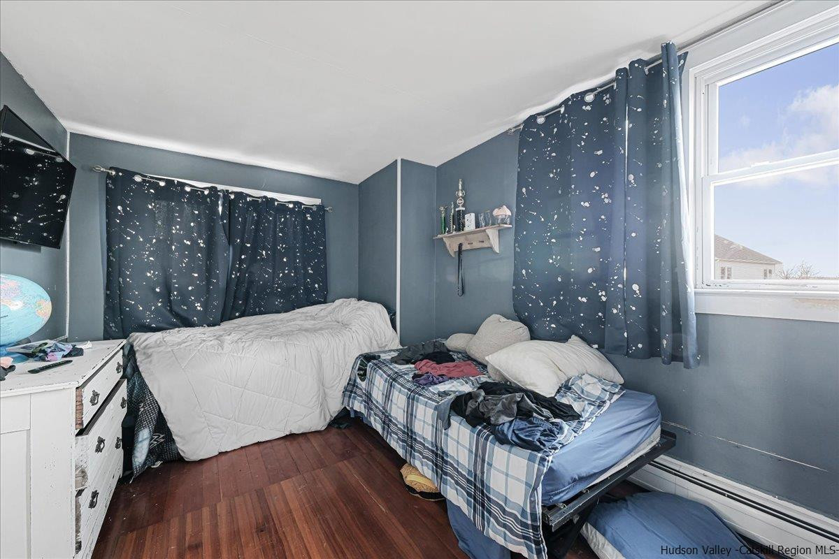 98 North Road Highland, NY 12528 - Photo 20 of 33 a bed sitting in a bedroom next to a window