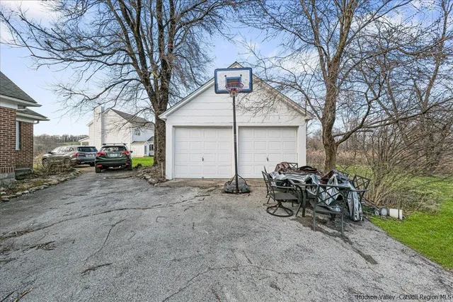 a car parked in front of white house