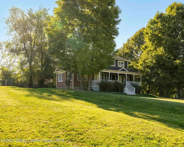 a view of a house with a big yard