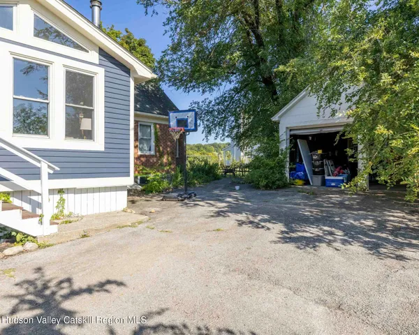 a view of a house with a street