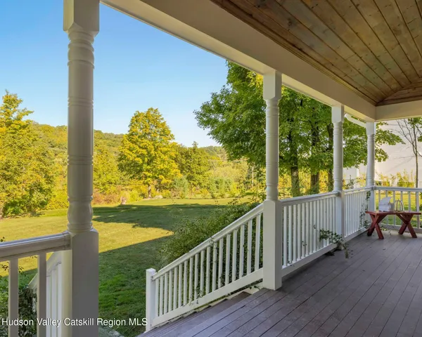 a view of balcony with wooden floor