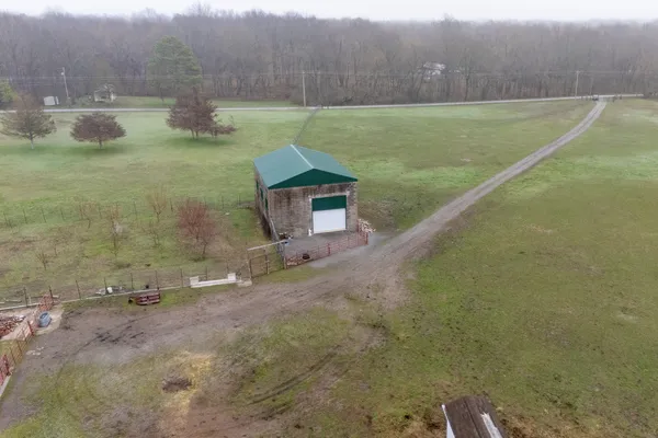 an aerial view of a house having yard